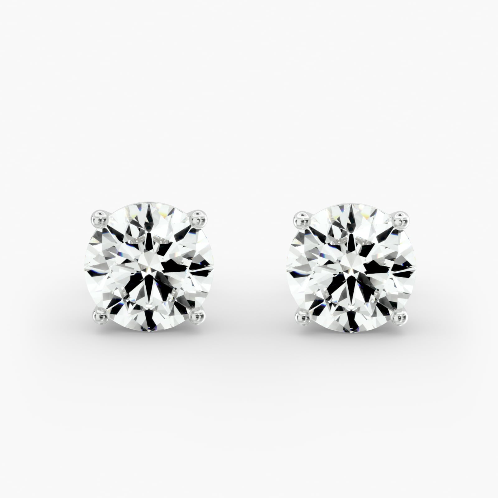 Four Prong Stud Earrings In Platinum